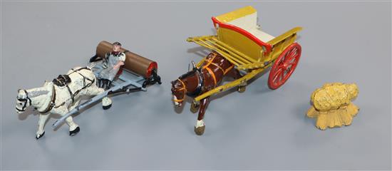 A collection of pre-war Britains Home Farm series models including a boxed farm wagon, boxed timber carriage, boxed tumbrel horse